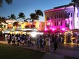 People enjoy themselves as they walk along Ocean Drive on March 18, 2021 in Miami Beach, Florida.