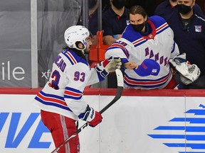 New York Rangers centre Mika Zibanejad is congratulated by goalie Alexandar Georgiev after completing his hat trick against Philadelphia last night. It was his second hat trick in eight days. He also added three assists against the Flyers.