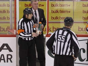 Referee Tim Peel, left, was relieved of his duties by the NHL. POSTMEDIA FILES