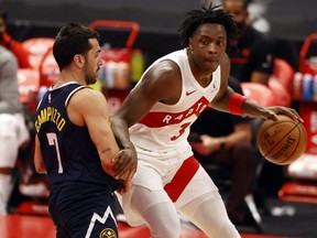 Raptors forward OG Anunoby (right) moves to the basket as Nuggets guard Facundo Campazzo (left) defends during first half NBA action at Amalie Arena in Tampa, Fla., Wednesday, March 24, 2021.