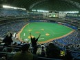 Fans cheer the Blue Jays on opening day 2004 at what was then called the SkyDome. GLENN LOWSON/POSTMEDIA FILES