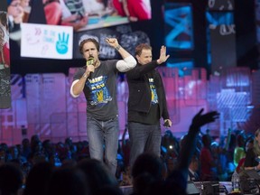 Craig Kielburger and Marc Kielburger speak during "We Day" in Toronto on Thursday, Oct. 2, 2014.