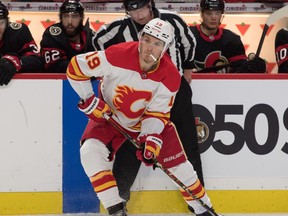Flames left wing Matthew Tkachuk (19) controls the puck during the first period against the Senators at the Canadian Tire Centre in Ottawa, Wednesday, March 24, 2021.
