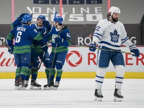 Vancouver Canucks forward Brock Boeser (6) and teammates celebrate Boeser’s goal against the Toronto Maple Leafs in the first period at Rogers Arena.