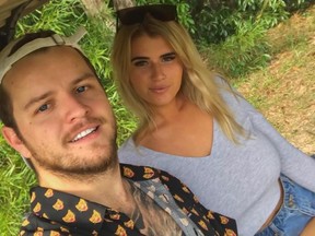 Australian adult model Holly-Daze Coffey poses for a picture with her boyfriend.