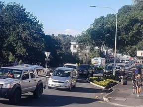 Traffic slowly works up to high ground at Whangarei, New Zealand, as a tsunami warning is issued Friday, March 5, 2021.