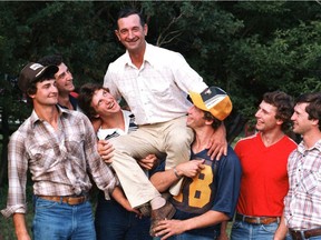 Louis Sutter who passed away in 2005, gets a lift from his sons (from left) Darryl, Duane, Ron, Rich, Brent and Brian on their farm in Viking, AB.