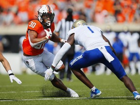 Running back Chuba Hubbard #30 of the Oklahoma State should be taken in the NFL draft over the next few days.