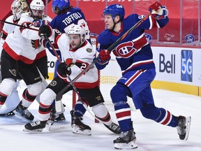 Defenceman Erik Brannstrom, middle, hasn't played in the three games since Ottawa recalled him from Belleville of the American Hockey League.