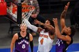 Derrick Rose of the New York Knicks attempts a shot as Khem Birch of the Toronto Raptors (right) defends earlier this month.