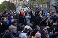 Chelsea fans celebrate outside the stadium before the match after reports suggest they are set to pull out of the European Super League.