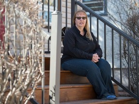 Nuelle Novik, an assistant professor of social work at the University of Regina and a researcher with SPHERU (Saskatchewan Population Health and Evaluation Research Unit), sits in front of her home in Regina, Saskatchewan on April 23, 2021. Novik is among researchers studying mental health in Saskatchewan adults throughout the pandemic.