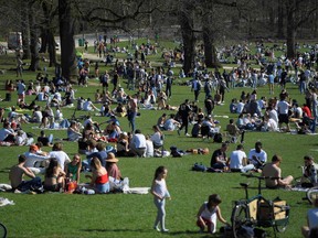 A picture taken on March 30, 2021 shows visitors enjoying the sunny weather in the Bois de la Cambre - Ter Kamerenbos in Brussels.
