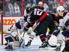 Senators centre Artem Anisimov (51) digs for a rebound off of Edmonton Oilers goaltender Mikko Koskinen during the first period on Wednesday at the Canadian Tire Centre.