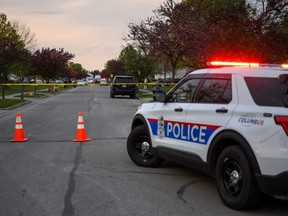 Investigators work at the scene where a fatal shooting by a police officer occurred in Columbus, Ohio, Tuesday, April 20, 2021.