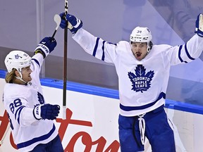 Toronto Maple Leafs' Auston Matthews (34) celebrates with teammate William Nylander (88).