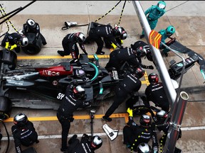 Lewis Hamilton of Great Britain driving the (44) Mercedes AMG Petronas F1 Team Mercedes W12 makes a pitstop for a new front wing following a crash during the F1 Grand Prix of Emilia Romagna at Autodromo Enzo e Dino Ferrari on April 18, 2021 in Imola, Italy.