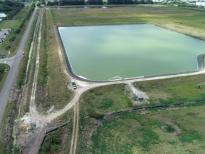 A reservoir of a defunct phosphate plant south of Tampa, where a leak at a waste water reservoir forced the evacuation of hundreds of homes and threatened to flood the area and Tampa Bay with polluted water, is seen in an aerial photograph taken in Piney Point, Fla., Sunday, April 4, 2021.