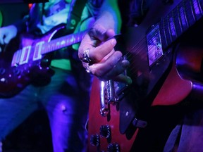 Pair of guitarists performing.