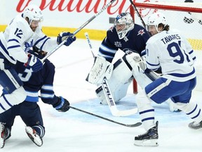 Winnipeg Jets goaltender Connor Hellebuyck got yanked 12 minutes into the first period on Thursday. KEVIN KING/Winnipeg Sun