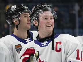 Team White left winger Alexis Lafreniere (11) smiles following the Canadian Hockey League Top Prospects game in Hamilton on Jan. 16, 2020.