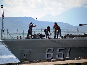 The Indonesian Navy patrol boat KRI Singa (651) prepares to load provisions at the naval base in Banyuwangi, East Java province, on April 24, 2021, as the military continues search operations off the coast of Bali for the Navy's KRI Nanggala (402) submarine that went missing April 21 during a training exercise.