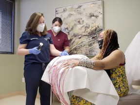 Ayanna Williams, of Houston, broke the Guinness World Record for the world's longest fingernails in 2017, when they measured nearly 19 feet long. They were measured at longer than 24 feet last week before she cut them off at a dermatology office in Forth Worth.