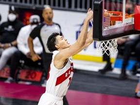 The Raptors' Yuta Watanabe dunks during a game in Cleveland on April 10. For the first time in his career, Watanabe showed up to practice on Tuesday with a standard NBA contract.