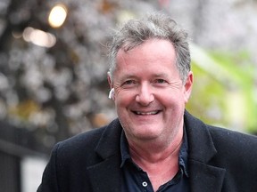 Journalist and television presenter Piers Morgan smiles as he walks near his house, after he left his high-profile breakfast slot with the broadcaster ITV, following his long-running criticism of Prince Harry's wife Meghan, in London, Britain, March 10, 2021.
