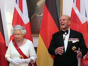 Queen Elizabeth and Prince Philip wait to greet guests prior to a state banquet at Bellevue presidential palace in Berlin, Germany June 24, 2015.