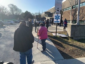 Dozens of people lined up outside the Bill-Durnan Arena in Côte-des-Neiges April 8, 2021, morning, one of seven sites across Montreal taking walk-ins for COVID-19 vaccinations.