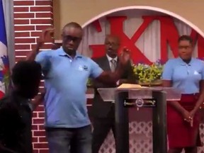 A pastor, centre, and church members are seen moments before they are kidnapped by gunmen while they were performing live on Facebook at the Seventh-day Adventist Gospel Kreyol Ministry Church in Diquini, Haiti.