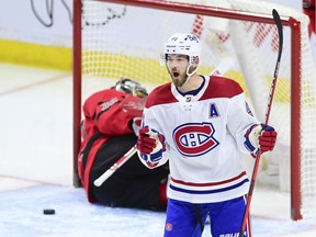 Montreal Canadiens' Paul Byron celebrates a short-handed goal on Ottawa Senators goalie Filip Gustavsson during second period in Ottawa on April 1, 2021.