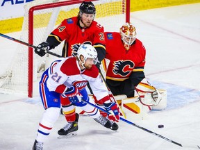 Flames goaltender Jacob Markstrom makes a save against Canadiens' Eric Staal (21) during the first period at Scotiabank Saddledome in Calgary on Saturday, April 24, 2021.