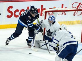 Toronto Maple Leafs goalie Jack Campbell (36) poke checks the puck away from Winnipeg Jets forward Blake Wheeler (26) during the third period at Bell MTS Place in Winnipeg on Saturday, April 24, 2021.