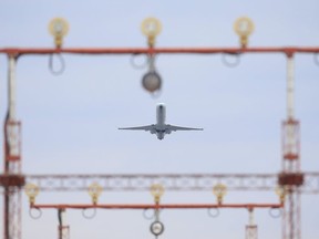 Air Canada passenger planes take off at Pearson International Airport on Sunday Jan. 24, 2021.