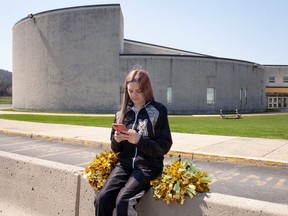 Brandi Levy, a former cheerleader at Mahanoy Area High School in Mahanoy City, Pennsylvania and a key figure in a major U.S. case about free speech, uses her phone in an undated photograph provided by the American Civil Liberties Union.
