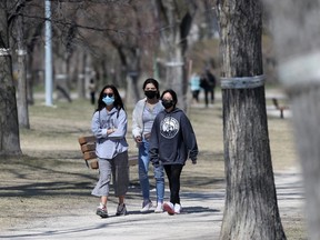 People wear masks while out in public, in Winnipeg. Tuesday, April 27, 2/2021.Winnipeg Sun/Chris Procaylo/stf