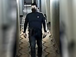 Investigators allege off-duty Toronto Police officer Travis Houston, 37, of Georgina, was captured on security video wearing a firearm while meeting with a sex trade worker at a York Region hotel on March 31, 2021.