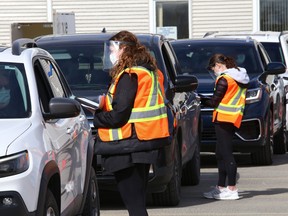A drive-thru vaccination clinic is held at the Primacy Medical Centre in a parking lot on Lasalle Boulevard in Sudbury, Ont. on Monday, May 10, 2021. The medical centre provided the Moderna vaccine in collaboration with Public Health Sudbury and Districts.