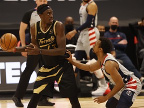 Toronto Raptors forward Pascal Siakam drives to the basket as Washington Wizards guard Ish Smith defends on Thursday night.