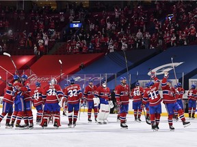 Members of the Montreal Canadiens salute the fans at the Bell Centre after their OT victory over the Toronto Maple Leafs in Game 6 of the first round of the 2021 Stanley Cup Playoffs on Saturday, May 29, 2021.