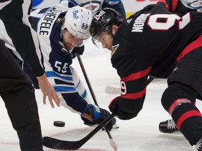 Josh Norris ofthe Senators faces off against Winnipeg Jets' Mark Scheifele at the Canadian Tire Centre. Norris routinely drew assignments to play against the top centres in the North Division this season.