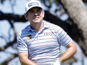 Louis Oosthuizen reacts after hitting from the seventh tee during the second round of the PGA Championship golf tournament on Friday. He is tied for the lead with Phil Mickelson. 442247