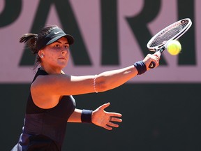 Bianca Andreescu plays a backhand in her first-round match against Tamara Zidansek during the French Open at Roland Garros on May 31, 2021 in Paris.