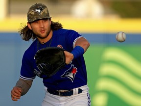 Bo Bichette of the Toronto Blue Jays fields a ball during a game against the Philadelphia Phillies at TD Ballpark on May 15, 2021 in Dunedin, Florida.