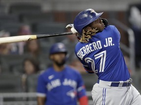 Blue Jays' Vladimir Guerrero Jr. swings for a home run off Atlanta Braves' Bryse Wilson in the sixth inning on Tuesday, May 11, 2021, in Atlanta.