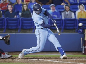 Blue Jays catcher Danny Jansen hits a single for a RBI during the second inning against the Red Sox at TD Ballpark in Dunedin, Fla., Tuesday, May 18, 2021.