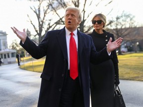 U.S. President Donald Trump gestures as he and first lady Melania Trump depart the White House to board Marine One ahead of the inauguration of president-elect Joe Biden, in Washington, D.C., Jan. 20, 2021.