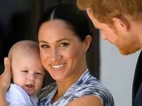 Britain's Prince Harry and his wife Meghan, Duchess of Sussex holding their son Archie.